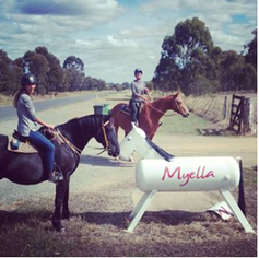 Picture of riders sitting on horses in a paddock.   Myella is a farm stay with horse riding.