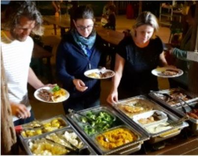 People serving dinner with roast beef and vegetables at Myella Farm Stay near Rockhampton the beef capital of Australia.